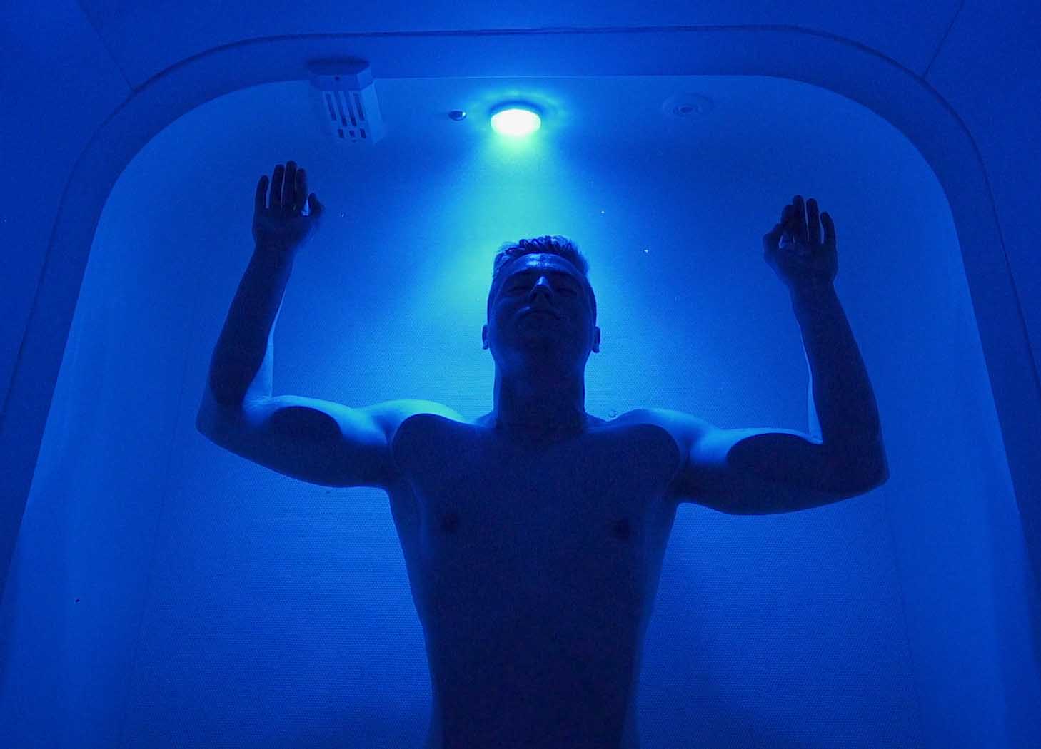 Man floating in float tank, from our client Floatology.